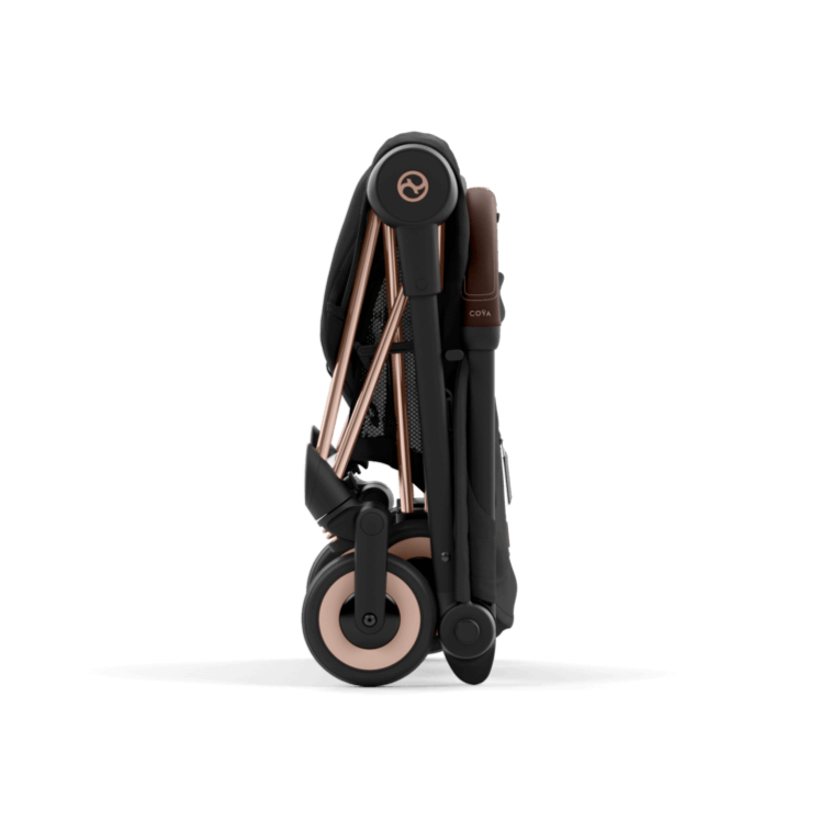 Folded stroller with rose gold accents on a black background