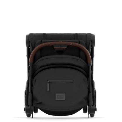 Black baby stroller with brown handle on a white background